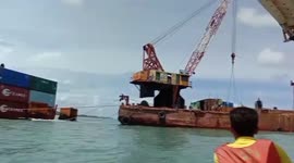 Beached cargo ship has containers removed a week after running aground in Thailand