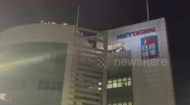 Apple Daily staff wave to Hong Kongers as tabloid shuts down under government pressure