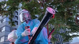 Volunteers use pick-up trucks to disinfect Vietnamese city