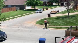 US gardener works smarter with leaf-blower and HOVERBOARD