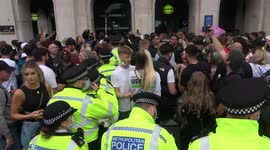 Clashes between protesters and police outside Parliament, London after police moved in to seize sound equipment.