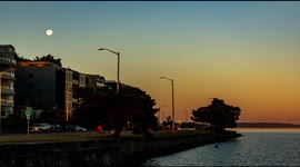Watch the sun rise as the moon sets from Anchor Park in Seattle
