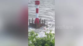 Volunteers rescued tourists trapped on lighthouse after water level rises in China