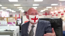 Madcap businessman decks out his entire bed shop with hundreds of St George's cross flags