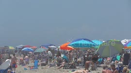 Millions of Americans flock to beaches as record-breaking heatwave grips northeastern states