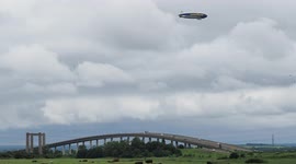 Goodyear Blimp flying low over the Sheppey Crossing in Kent, UK