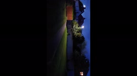 Football hooligans after a match shouting letting off flares and fireworks climbing on fences and cars, during Lockdown