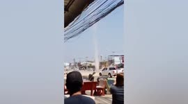 Dramatic moment dust devil tornado rips through street in Thailand
