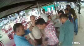 Indian police kick and push pistol into belly of gang boss accused of robbery and rape