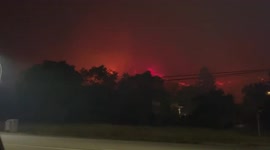 Wildfire burns in distance as Canadian city residents prepare to evacuate