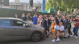 England fans throw beer and abuse at female driver of car they stop in central London