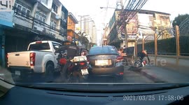 Motorcycle rider crashes onto pavement after car door in front suddenly opened