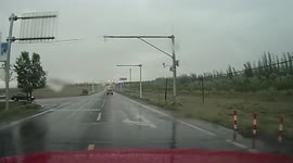 Lightning strikes road during a storm in China