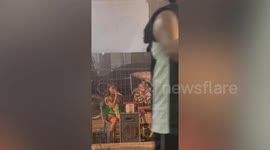 Youngster with beautiful voice sings perfect song on her grandfather’s karaoke busking machine