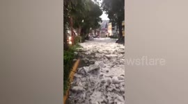 Thick layer of hail covers streets as heavy storm hits Mexico