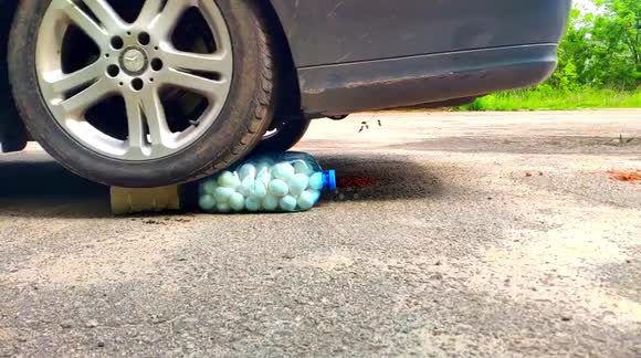 Eggs spray out of bottle as they're crushed by car in bizarre experiment