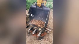 Chinese workman uses digger's bucket as wok to fry chicken