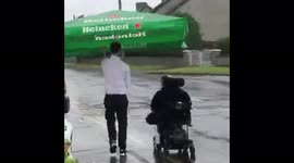 ‘True gentleman’: Facebook users praise barman after he escorts punter home in pouring rain – using pub garden PARASOL as umbrella