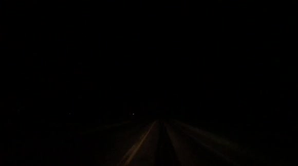 Massive close Lightning strike on a road while driving down highway