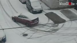 'Madrid: Car Skids on Snow Amid Historical Snowfall '