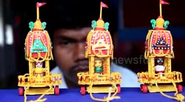 Artist crafts miniature models of chariots of Hindu deities using matchsticks in eastern India