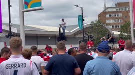 Euro 2020 England Fan Stood on top of a traffic light being pelted with empty cans and cans full of urine