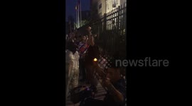 Protest crowd gather outside the Cuban Embassy in Washington DC