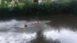 Barnes Green becomes a swimming pool as flash floods hit London