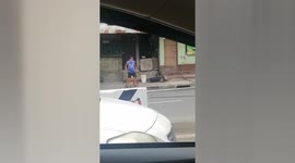 Pet dog helps owner sell Covid-19 face shields on street