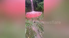 Locals bemused as river turns red after rainfall in central China