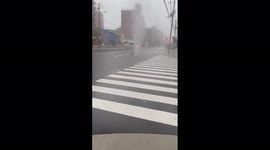Water sprays out of manholes like geysers during rainfall in Osaka, Japan