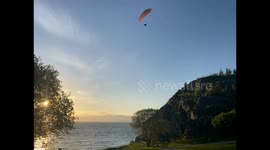 Paraglider Soars Through Beautiful Sunset in Trondheim Norway