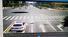 Car falls down giant hole on road in China