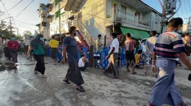 People in Yangon, Myanmar lining up with their oxygen tanks at the oxygen refill station
