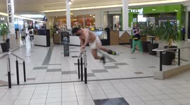 Man in diaper recklessly rollerblades through mall and miserably fails landing