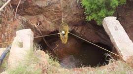 Mother and son hauled out of well by firefighters in southern India