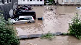 Relentless rains flood roads and wash away vehicles in western Germany