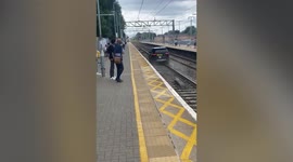 Commuters watch in horror as stolen Range Rover drives down RAIL TRACKS in UK