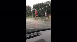 Flood in Germany - road underwater - police helping with traffic