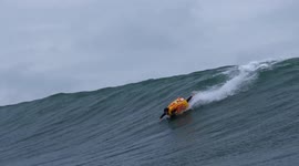Moment French surfer abandoned board and skimmed along water in giant SUMO SUIT