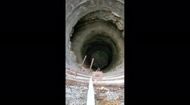 Watch - Clever Monkey Jumped out holding the rope thrown by villagers for rescue