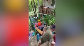 Cool DIY creation lets kayaking tourists slide down bank into river