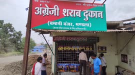 Watch - More video - This dipso monkey jumped into Alcohal shop and drunk full bottle , later rescued