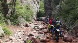 Enduro bikes circulating through a small river, within @pascuetooffroadcenter.