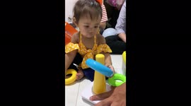 Learning how to fit in the shapes. Cute antics from my daughter.