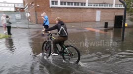 Teenager Takes Advantage Of The Flooding Of The River Roding