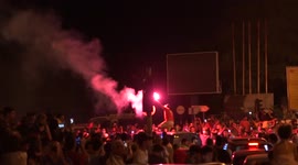 Celebrations on the streets of Tunis after president sacks prime minister, dissolves government