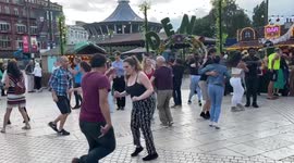 Unsure about most foreign destinations, Brits adopt foreign entertainment in UK resorts, watch people doing salsa dance in Bournemouth centre
