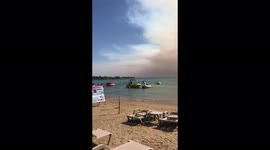 Plumes of smoke hover over beach in Manavgat, Turkey, as massive forest fire spreads