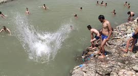 Unable to afford luxurious swimming pool local youngsters team up to beat the scorching summer heat at a natural water stream in Northern India